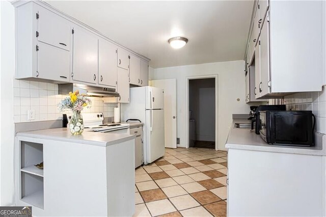 2620 Clairmont Rd, Atlanta, GA 30329 - kitchen featuring under cabinet range hood, white appliances, light countertops, decorative backsplash, and a peninsula