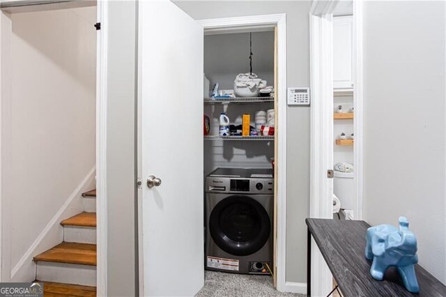 2620 Clairmont Rd, Atlanta, GA 30329 - laundry area featuring washer / dryer, baseboards, and light carpet
