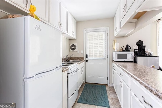 2620 Clairmont Rd, Atlanta, GA 30329 - kitchen featuring white appliances, a sink, and white cabinets