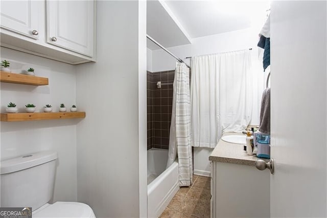 2620 Clairmont Rd, Atlanta, GA 30329 - bathroom with toilet, vanity, shower / bathtub combination with curtain, and baseboards
