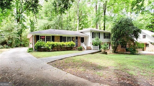 2620 Clairmont Rd, Atlanta, GA 30329 - split level home with driveway, a front yard, and brick siding