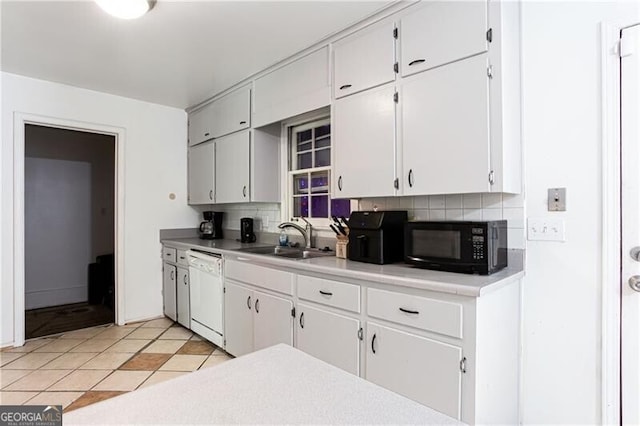 2620 Clairmont Rd, Atlanta, GA 30329 - kitchen with a sink, black microwave, dishwasher, backsplash, and light countertops