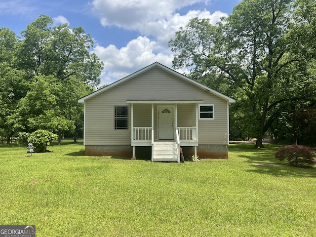view of front facade with a porch and a front yard