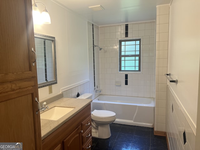 bathroom with toilet, vanity, and  shower combination