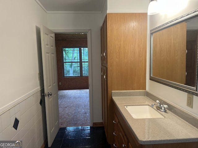 bathroom featuring vanity and wainscoting