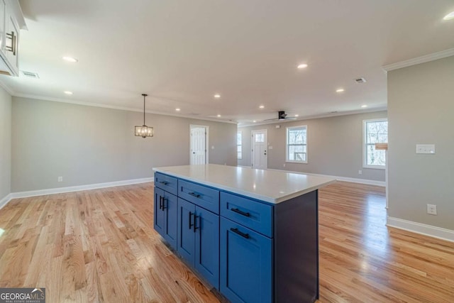 2741 Pierce Rd, Gainesville, GA 30507 - kitchen featuring ornamental molding, light wood-style floors, baseboards, recessed lighting, and a center island