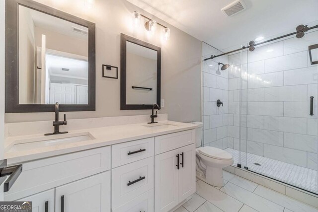 2741 Pierce Rd, Gainesville, GA 30507 - bathroom with a shower stall, toilet, and double vanity