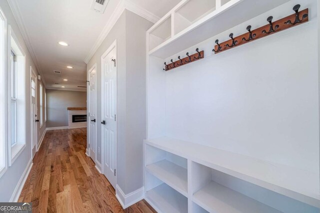 2741 Pierce Rd, Gainesville, GA 30507 - mudroom with ornamental molding, wood finished floors, recessed lighting, a fireplace, and baseboards