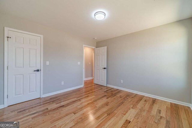 2741 Pierce Rd, Gainesville, GA 30507 - unfurnished bedroom with light wood-style floors and baseboards