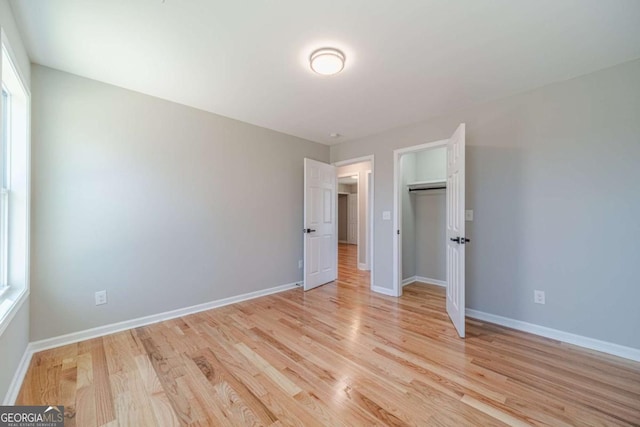 2741 Pierce Rd, Gainesville, GA 30507 - unfurnished bedroom with light wood-style flooring, baseboards, and a closet