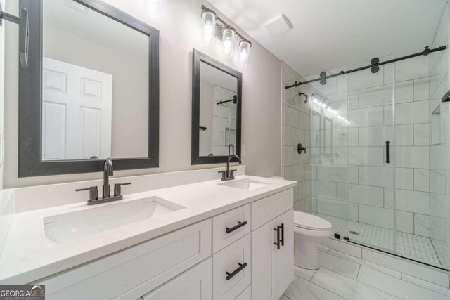 2741 Pierce Rd, Gainesville, GA 30507 - full bathroom with a shower stall, double vanity, toilet, and marble look tiles