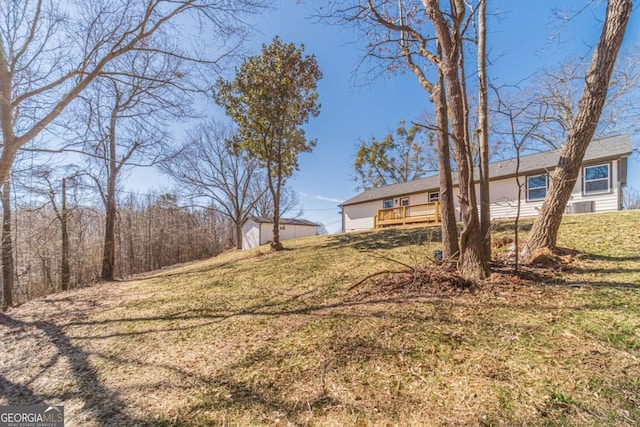 2741 Pierce Rd, Gainesville, GA 30507 - view of green lawn with an outbuilding, a shed, and a deck