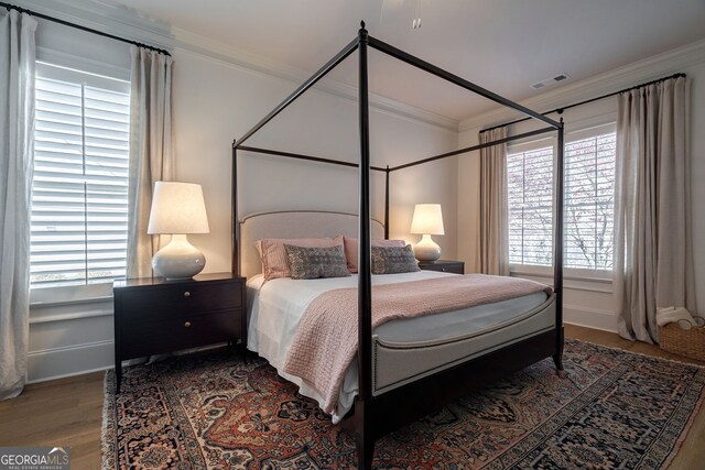 2970 Greenleffe Dr, Statham, GA 30666 - bedroom featuring crown molding, wood finished floors, and baseboards