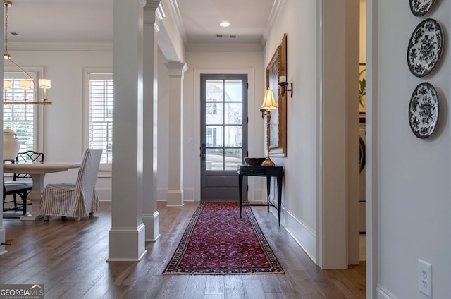 2970 Greenleffe Dr, Statham, GA 30666 - entrance foyer with decorative columns, healthy amount of natural light, wood finished floors, and crown molding