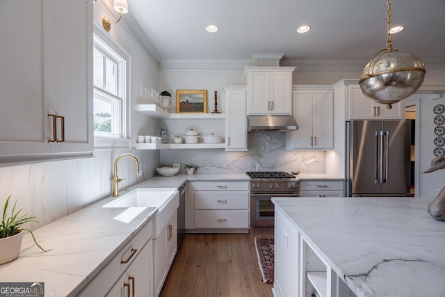 2970 Greenleffe Dr, Statham, GA 30666 - kitchen with premium appliances, open shelves, under cabinet range hood, white cabinetry, and light stone counters