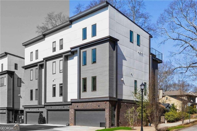 1836 Memorial Dr Unit 303, Atlanta, GA 30317 - view of front of property featuring an attached garage and driveway