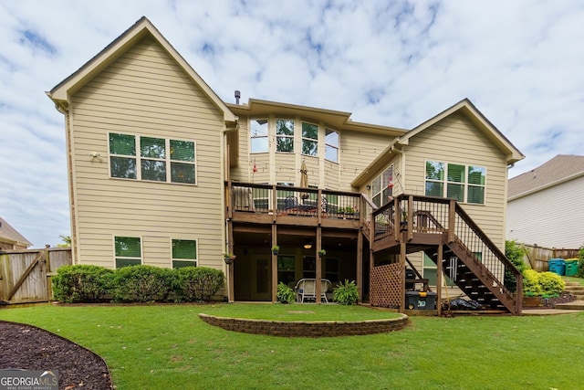 back of house featuring a wooden deck and stairs