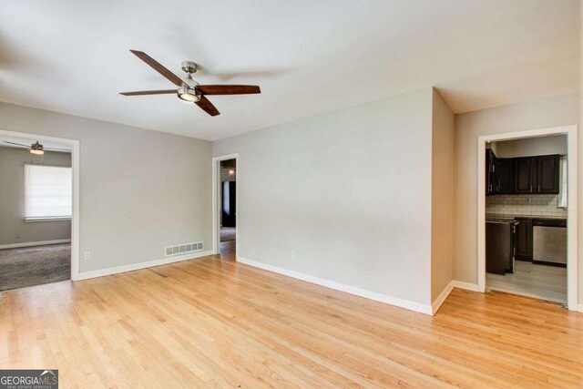 2564 Riggs Dr, East Point, GA 30344 - unfurnished living room featuring ceiling fan and light wood finished floors