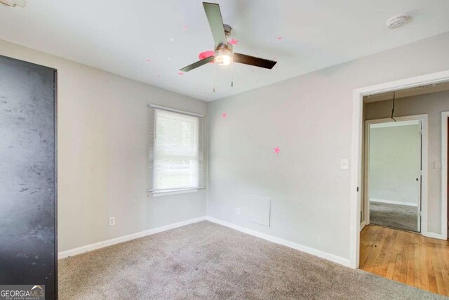 2564 Riggs Dr, East Point, GA 30344 - unfurnished bedroom featuring carpet and a ceiling fan