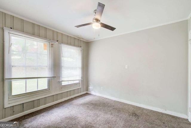 2564 Riggs Dr, East Point, GA 30344 - carpeted spare room with ornamental molding and a ceiling fan