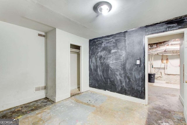 2564 Riggs Dr, East Point, GA 30344 - unfurnished bedroom with unfinished concrete floors