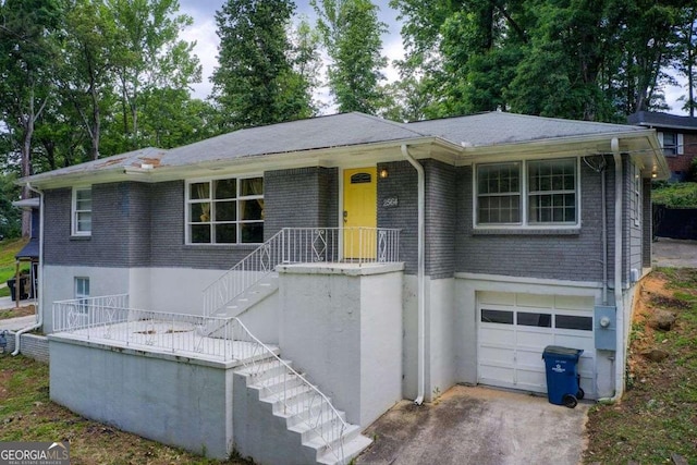 2564 Riggs Dr, East Point, GA 30344 - ranch-style home featuring stairway, a garage, brick siding, and stucco siding