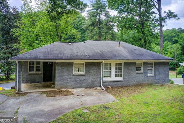 2564 Riggs Dr, East Point, GA 30344 - ranch-style home with roof with shingles, a front lawn, and brick siding
