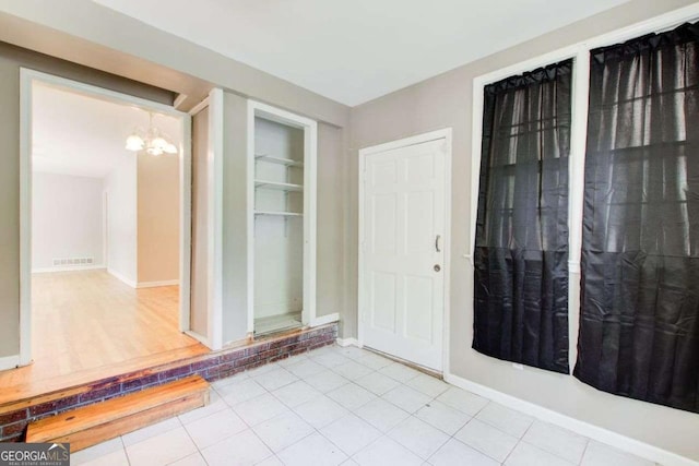 2564 Riggs Dr, East Point, GA 30344 - entryway with a chandelier and tile patterned flooring