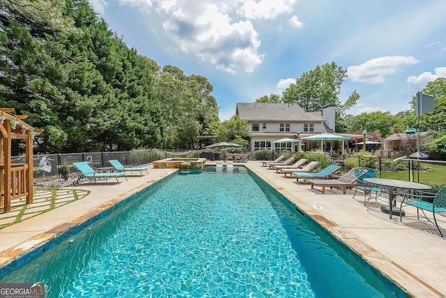 4135 Creekwood Dr, Cumming, GA 30041 - view of swimming pool featuring a patio area, fence, and a pool with connected hot tub