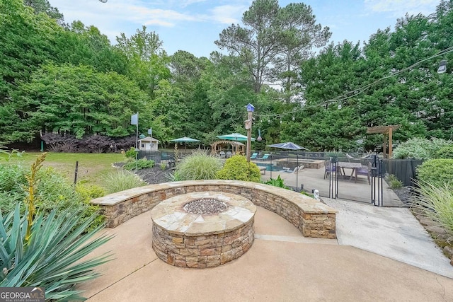 4135 Creekwood Dr, Cumming, GA 30041 - view of patio / terrace featuring a fire pit, fence, and view of scattered trees