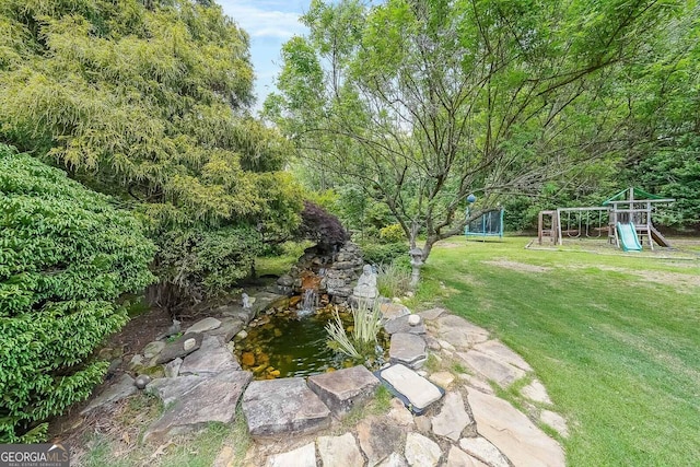 4135 Creekwood Dr, Cumming, GA 30041 - view of grassy yard with a playground