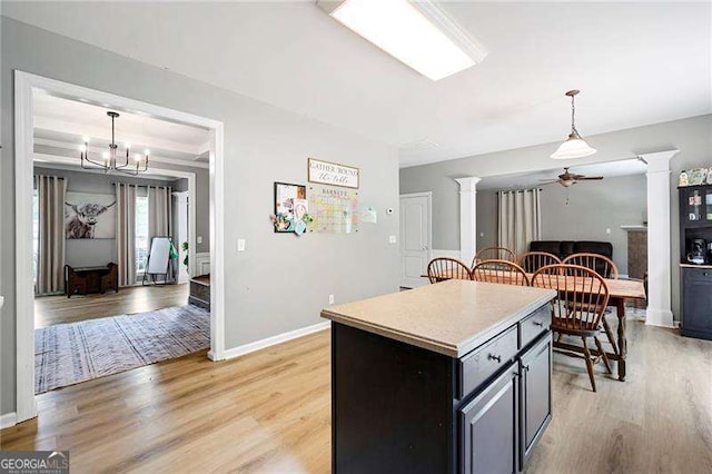 40 Boulder Ct, Dallas, GA 30132 - kitchen with decorative columns, a ceiling fan, light wood-type flooring, and pendant lighting