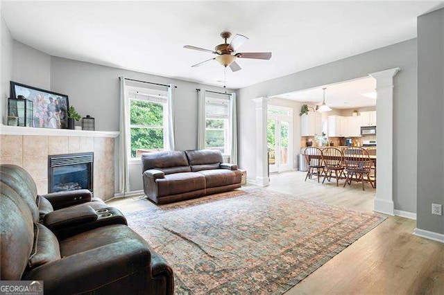 40 Boulder Ct, Dallas, GA 30132 - living area featuring baseboards, ceiling fan, healthy amount of natural light, and light wood-style floors