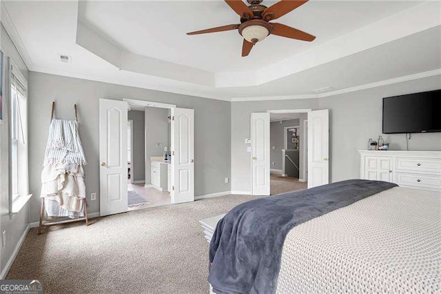 40 Boulder Ct, Dallas, GA 30132 - bedroom featuring a tray ceiling, baseboards, light colored carpet, ensuite bathroom, and ornamental molding