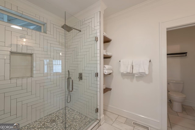 1231 Mansfield Ave NE, Atlanta, GA 30307 - bathroom with a shower stall, toilet, ornamental molding, and baseboards