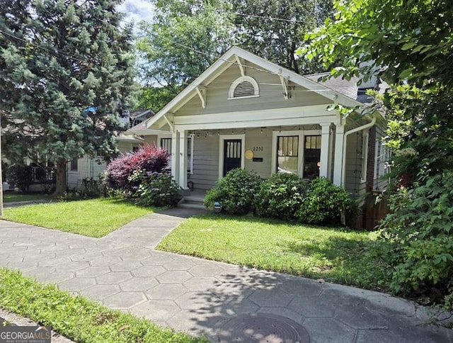 1231 Mansfield Ave NE, Atlanta, GA 30307 - view of front facade with covered porch and a front yard