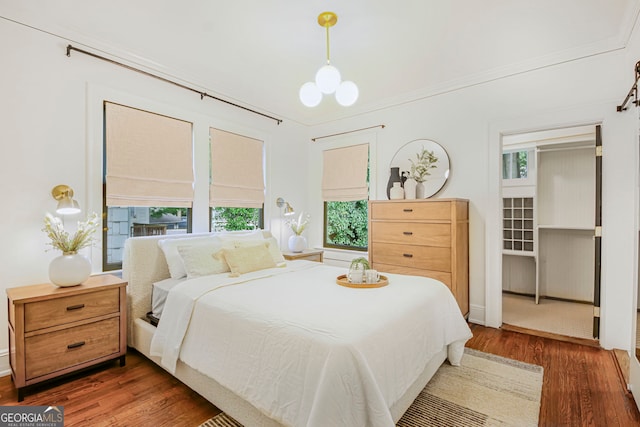 1231 Mansfield Ave NE, Atlanta, GA 30307 - bedroom featuring wood finished floors and multiple windows