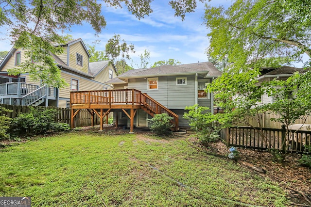 1231 Mansfield Ave NE, Atlanta, GA 30307 - back of house with stairs, a fenced backyard, and a wooden deck