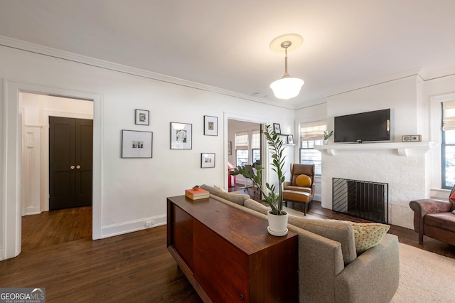 1231 Mansfield Ave NE, Atlanta, GA 30307 - living area with a fireplace, dark wood-style floors, ornamental molding, and baseboards