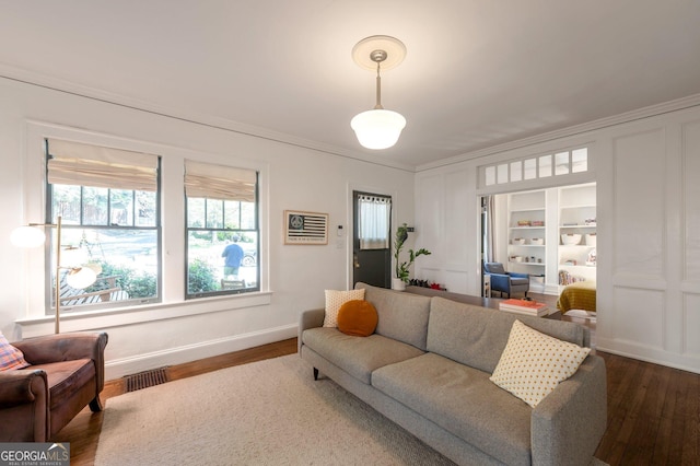 1231 Mansfield Ave NE, Atlanta, GA 30307 - living area featuring dark wood-type flooring, ornamental molding, and baseboards