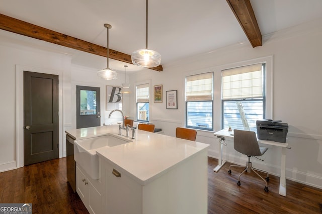 1231 Mansfield Ave NE, Atlanta, GA 30307 - kitchen with a sink, stainless steel dishwasher, beam ceiling, an island with sink, and dark wood finished floors