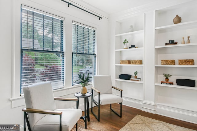 1231 Mansfield Ave NE, Atlanta, GA 30307 - sitting room with wood finished floors, plenty of natural light, and built in features