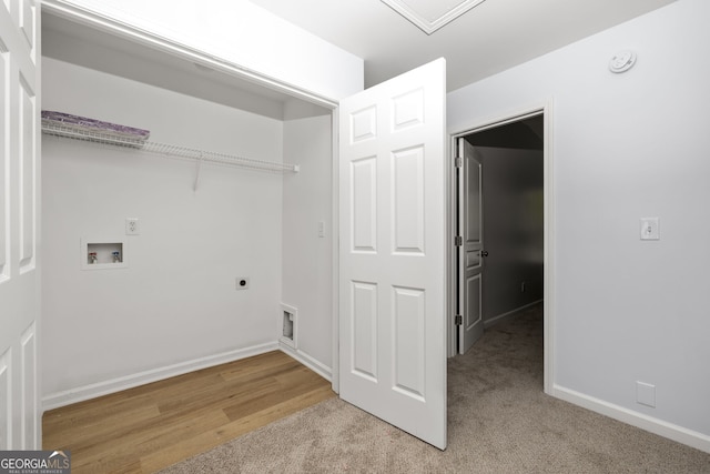 4457 Watson Ridge Dr, Stone Mountain, GA 30083 - clothes washing area with light colored carpet, hookup for a washing machine, electric dryer hookup, and baseboards