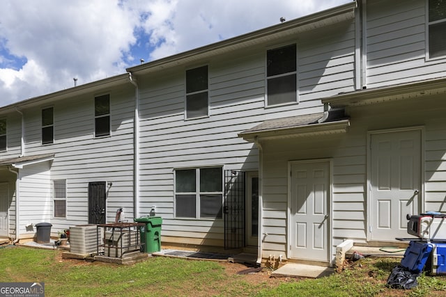4457 Watson Ridge Dr, Stone Mountain, GA 30083 - back of property featuring central AC unit and a lawn