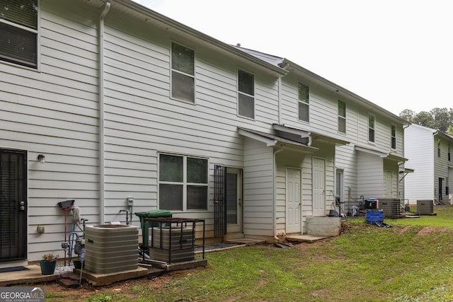 4457 Watson Ridge Dr, Stone Mountain, GA 30083 - back of house with central AC and a yard