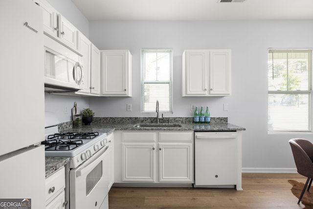 4457 Watson Ridge Dr, Stone Mountain, GA 30083 - kitchen featuring white appliances, a sink, white cabinetry, and dark stone counters