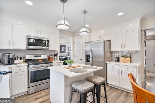 565 Barsham Way, Johns Creek, GA 30097 - kitchen with stainless steel appliances, white cabinetry, light countertops, decorative backsplash, and recessed lighting