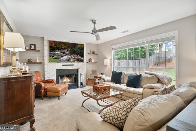 565 Barsham Way, Johns Creek, GA 30097 - carpeted living room featuring a ceiling fan and a stone fireplace