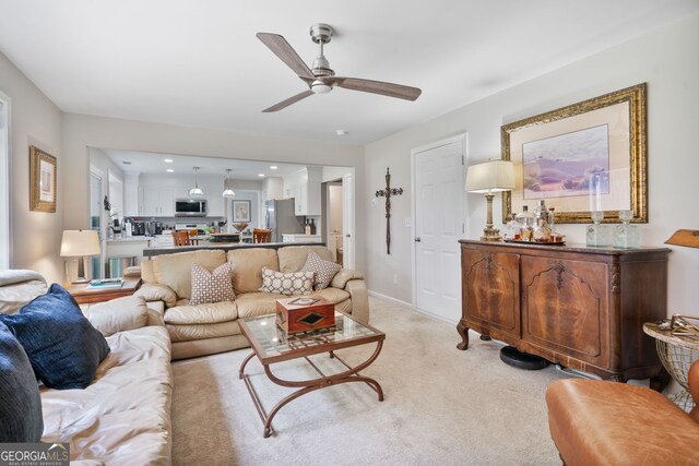 565 Barsham Way, Johns Creek, GA 30097 - living room with a ceiling fan, light carpet, and baseboards