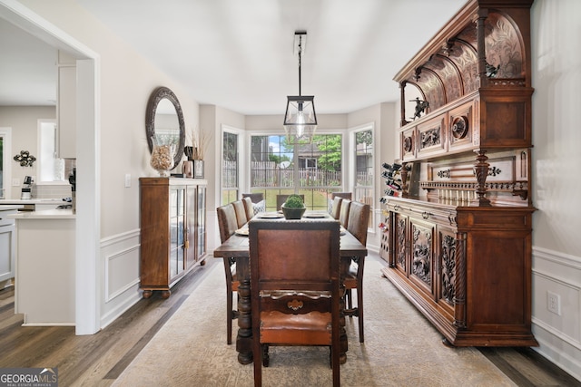 565 Barsham Way, Johns Creek, GA 30097 - dining area with wood finished floors, a decorative wall, and wainscoting